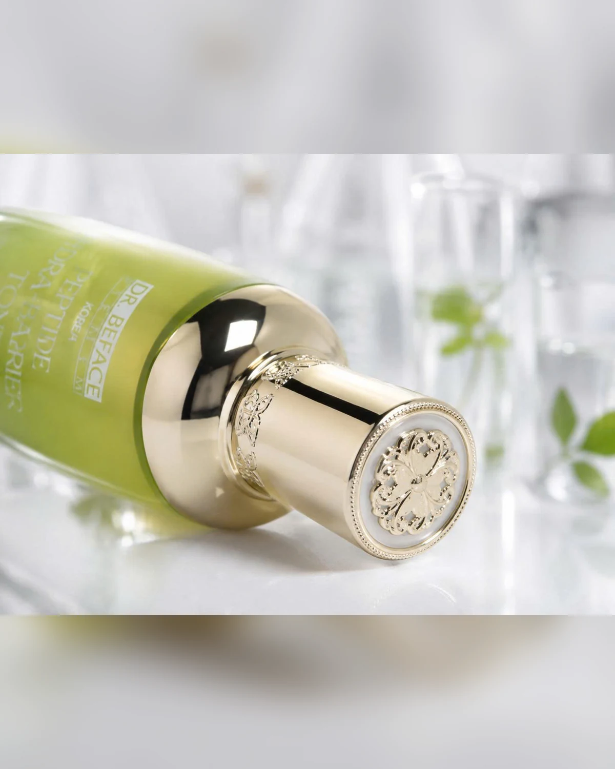 Gold cap detail — DR.BEFACE PREMIUM PEPTIDE HYDRA-BARRIER TONER